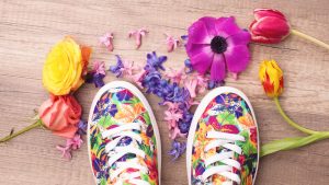 Sneakers and flowers around